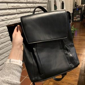 Black faux leather backpack